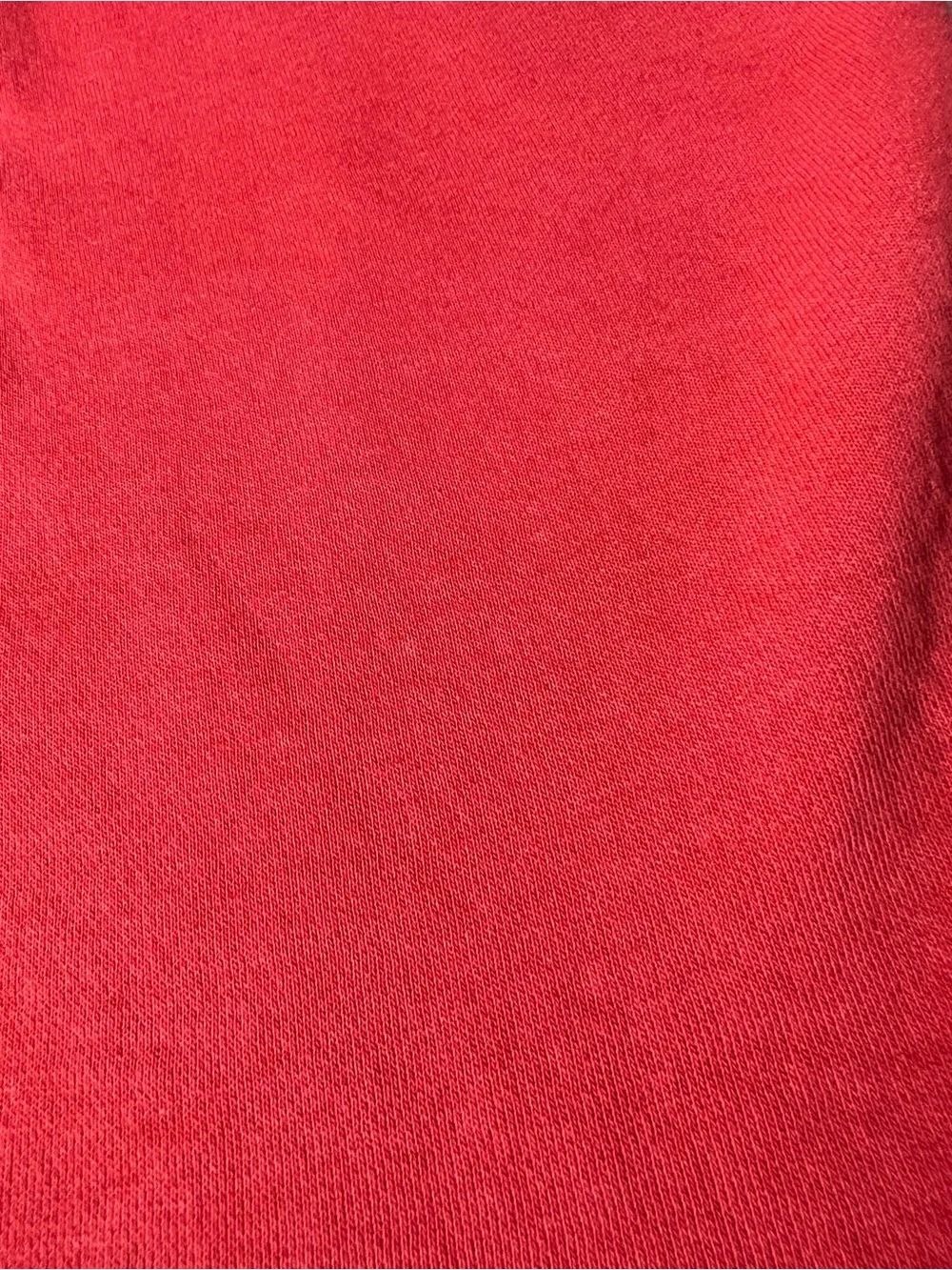 Hollister Co. red sweatpants with white vertical text reading 'HOLLISTER'